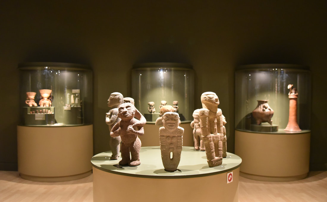 TRANSLUCID SEEDS. View of the archeologicaL hall. 2017. Furniture design & lighting design to exhibit the pre-Columbian pieces by Rossella Matamoros. (The Cosmic Talamancan House). Wiew of the 8 stone sculptures of women. 2017.